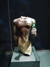 Torso of a Priest Wearing a Leopard Skin; Egyptian, Dynasties 25-26, 700-600 BCE; found in the Temple of Hera on Samos. As early as the mid-seventh century BCE, Greeks returning to their homes from Egypt brought back objects to be dedicated in sanctuaries. Some votives found in Greece, however, may have been donated by Egyptians. The pharaoh Amasis II (ruled 570-527 BCE) himself was renowned for giving valuable works to temples on the Greek islands of Samos and Rhodes. This torso was one of many Egyptian bronze offerings deposited on Samos.